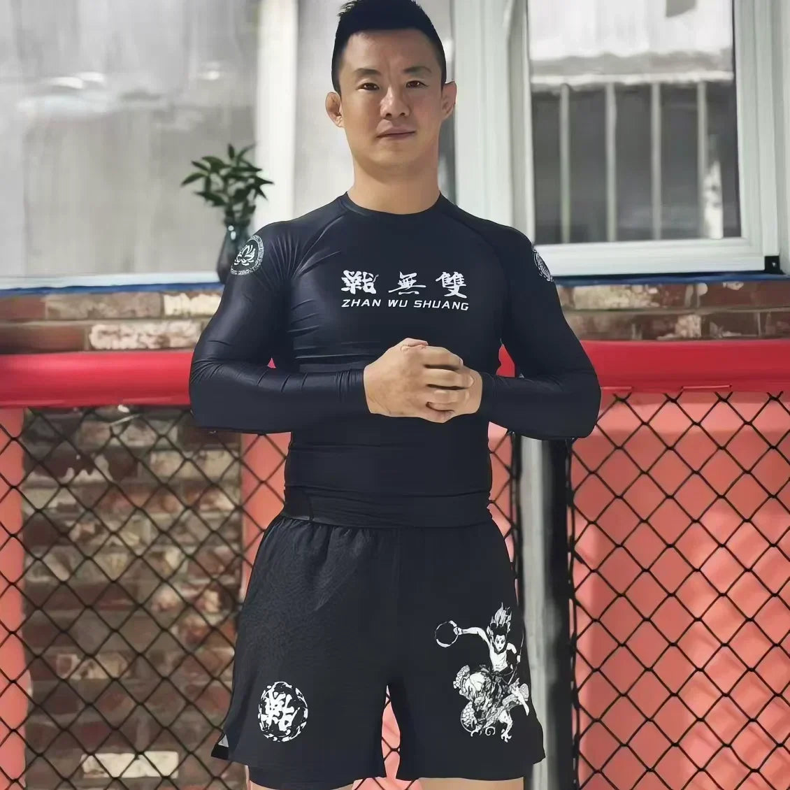 Custom Rash Guards and No-Gi Shorts: What to Know Before Printing - Model in black rash guard and shorts.