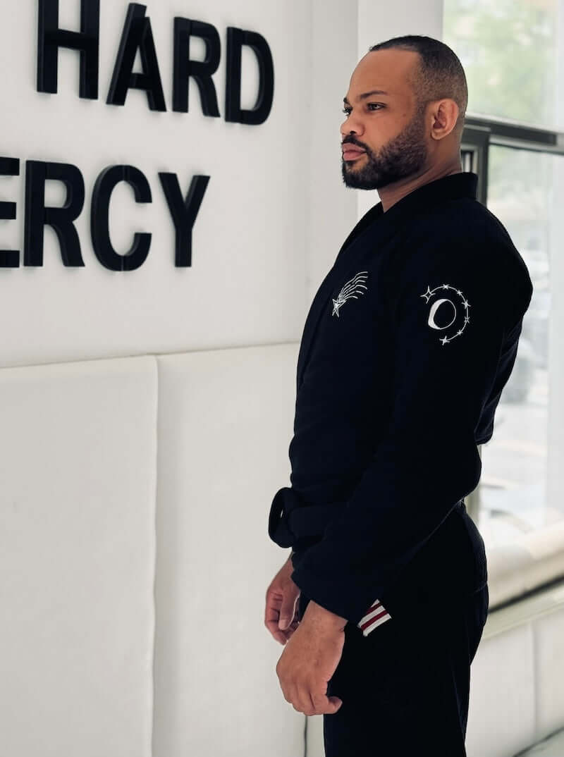BLITZ Sun & Moon Brazilian Jiu-Jitsu Gi showcased by athlete in a training environment, emphasizing style and durability.